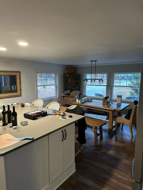 Open dining nook with chandelier lighting