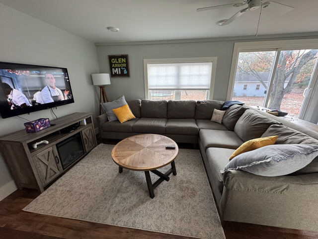 Living room with sectional couch and TV