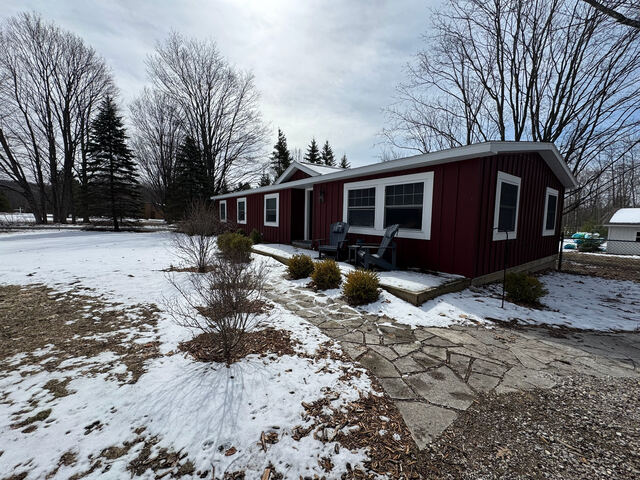 Snow-covered exterior with cleared walkway